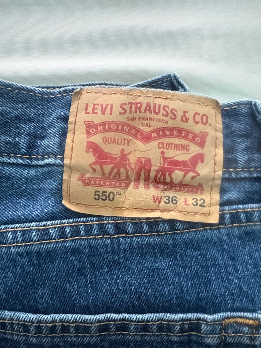 Levi's 550 Relaxed Jeans in Medium Blue with Tan Patch
